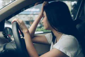 Female driver in accident considering hiring a personal injury lawyer in Charleston, WV