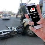 Man Using Smartphone At Roadside After Car Accident